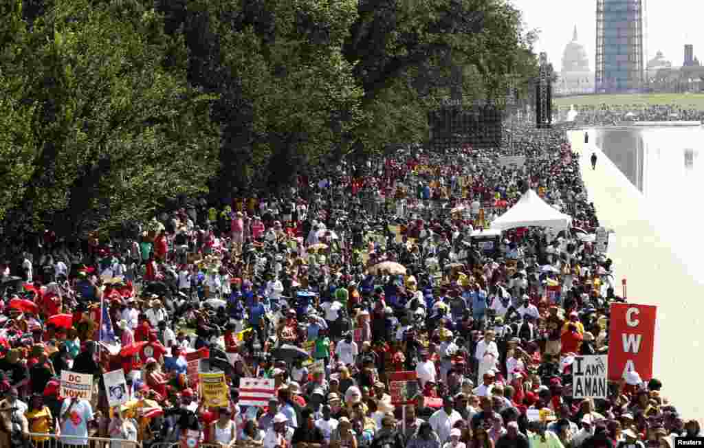 Marchers gather along the reflecting pool on the National Mall during the 50th anniversary of the 1963 March on Washington for Jobs and Freedom at the Lincoln Memorial in Washington Aug. 24, 2013.