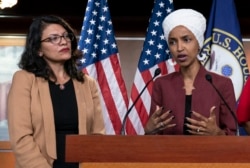 FILE - U.S. Reps. Ilhan Omar, right, and Rashida Tlaib, both Democrats, are seen during a news conference at the Capitol, in Washington, July 15, 2019.