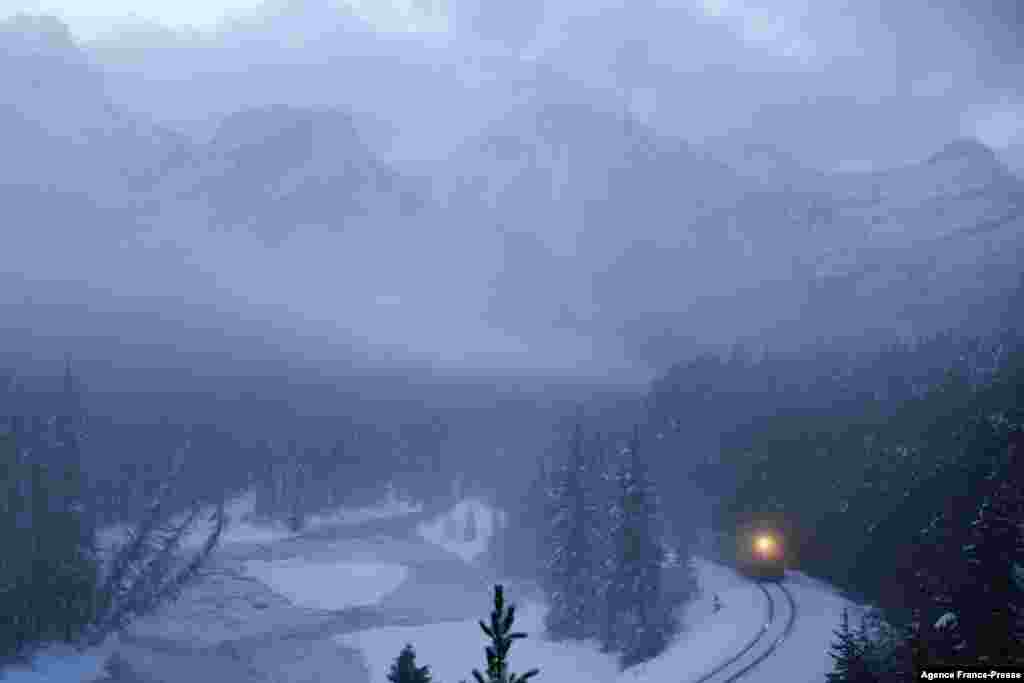 A Canadian Pacific freight train is seen past Morant's Curve near Lake Louise in Banff National Park, Alberta, Canada, Nov. 29, 2021.