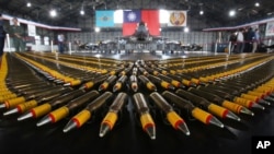 Bullets are lined up in front of a U.S. made F-16V fighters during a military exercise in Chiayi County, southern of Taiwan, Jan. 15, 2020.