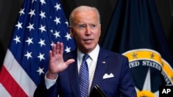 President Joe Biden finishes speaking during a visit to the Office of the Director of National Intelligence in McLean, Va., July 27, 2021. 