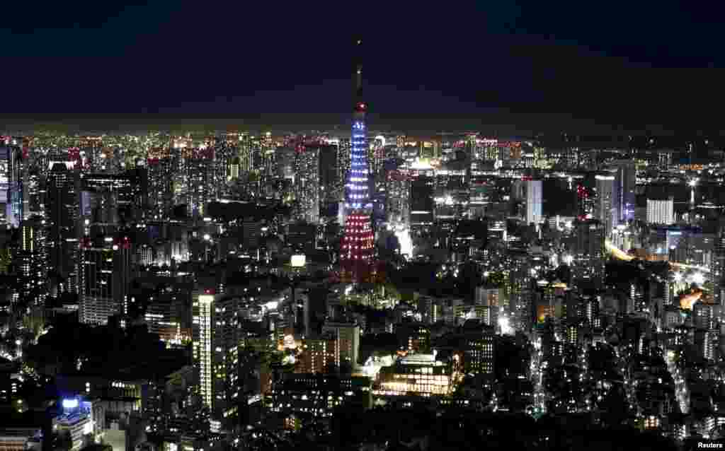 Tokyo Tower is illuminated in blue, white and red, the colors of the French flag, in response to the Paris attacks, in Tokyo, Japan.