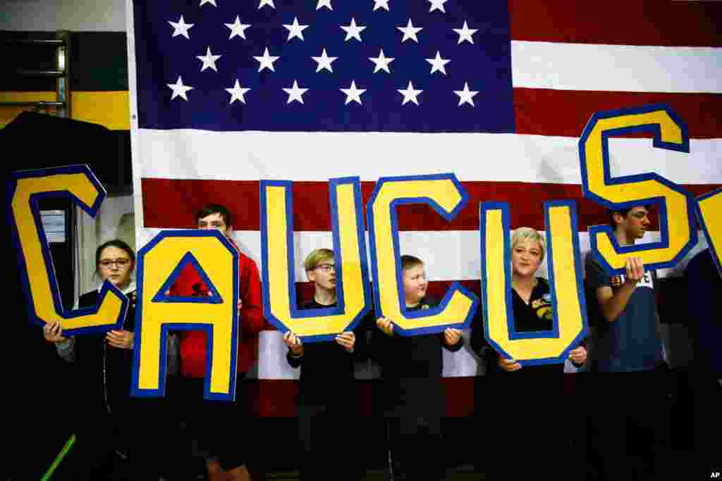 Attendees hold letters that read "CAUCUS" during a campaign event in South Bend, Indiana, Feb. 2, 2020.