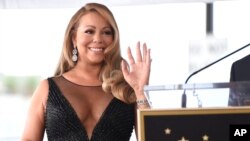 FILE - Mariah Carey attends a ceremony honoring her with a star on the Hollywood Walk of Fame in Los Angeles, Aug. 5, 2015.