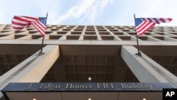 FILE - The Pennsylvania Avenue entrance of the J. Edgar Hoover Federal Bureau of Investigations (FBI) building is seen in Washington, Nov. 30, 2017.