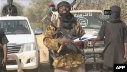 FILE - Boko Haram leader Abubakar Shekau appears in a video image obtained by AFP in January. 
