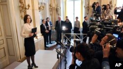 FILE - Permanent Secretary of the Swedish Academy Sara Danius announces the 2016 Nobel Prize in Literature during a presser at the Old Stockholm Stock Exchange Building in Stockholm, Sweden, Oct. 13, 2016. 