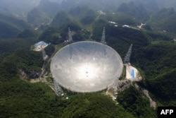 This handout photo taken Aug. 24, 2016 and released Dec. 13, 2020, by the National Astronomical Observatories of the Chinese Academy of Sciences (NAOC) shows the 500-meter Aperture Spherical Radio Telescope (FAST) in China's Guizhou province.