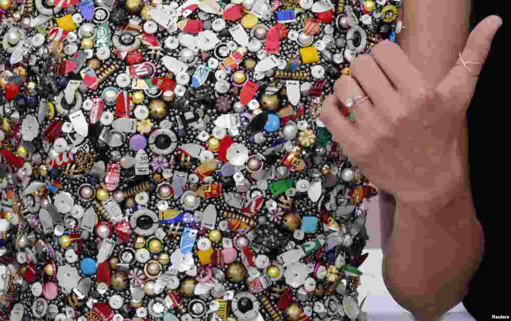 Detail of Marion Cotillard's dress is pictured as she poses during a photocall for the film Deux Jours, Une Nuit (Two Days, One Night) in competition at the 67th Cannes Film Festival.