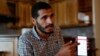 Palestinian journalist Hassan Slaieh shows his blocked Facebook page during an interview in Gaza City, Oct. 18, 2021.