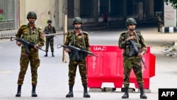 Bangladesh army personnel stand guard during a curfew following clashes between police and Anti-Discrimination Student Movement activists amid anti-government protests in the Shahbag area of Dhaka on Aug. 5, 2024.