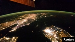 A NASA image released last February taken from the International Space Station a month earlier showing the night view of the Korean Peninsula, and North Korea in the middle is almost completely dark compared to neighboring South Korea (bottom right) and China (top left). REUTERS/NASA-JSC/Handout 