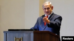 FILE - Israeli Prime Minister Benjamin Netanyahu gestures as he speaks during a news conference at the State House in Entebbe, Uganda, Feb. 3, 2020.