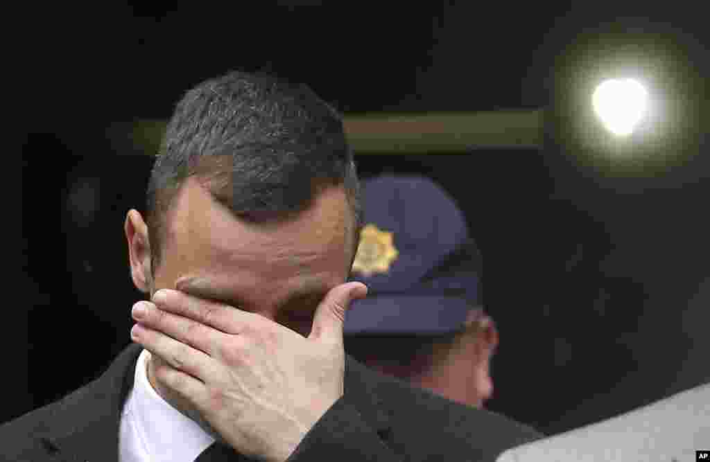 Oscar Pistorius leaves the high court in Pretoria, April 14, 2014.