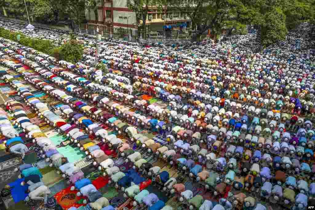 Tablighi Jamaat's Muslim devotees offer Friday prayers along a road in Dhaka.