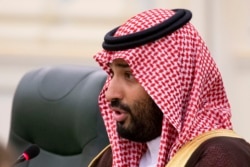 Saudi Arabia's Crown Prince Mohammed bin Salman speaks to Russian President Vladimir Putin during the talks in Riyadh, Saudi Arabia, Oct. 14, 2019.