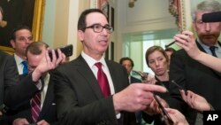 Treasury Secretary Steve Mnuchin speaks with reporters as he departs the Republican policy luncheon on Capitol Hill, Jan. 15, 2019.