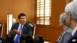 FILE - Keith Krach, left, U.S. undersecretary of state for Economic Growth, Energy and the Environment, talks with South Korea's Foreign Minister Kang Kyung-wha, second from right, during their meeting at the Foreign Ministry in Seoul, Nov. 6, 2019.
