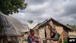 People displaced by conflict sit in a camp in Komanda, Ituri province, eastern Democratic Republic of Congo, Aug. 30, 2023.