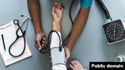 Nurse taking blood pressure