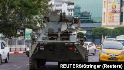 Myanmar, Yangon, An armoured vehicle rides on a street during a protest against the military coup