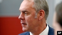 U.S. Interior Secretary Ryan Zinke walks through the Western Conservation and Hunting Expo, Feb. 9, 2018, in Salt Lake City.