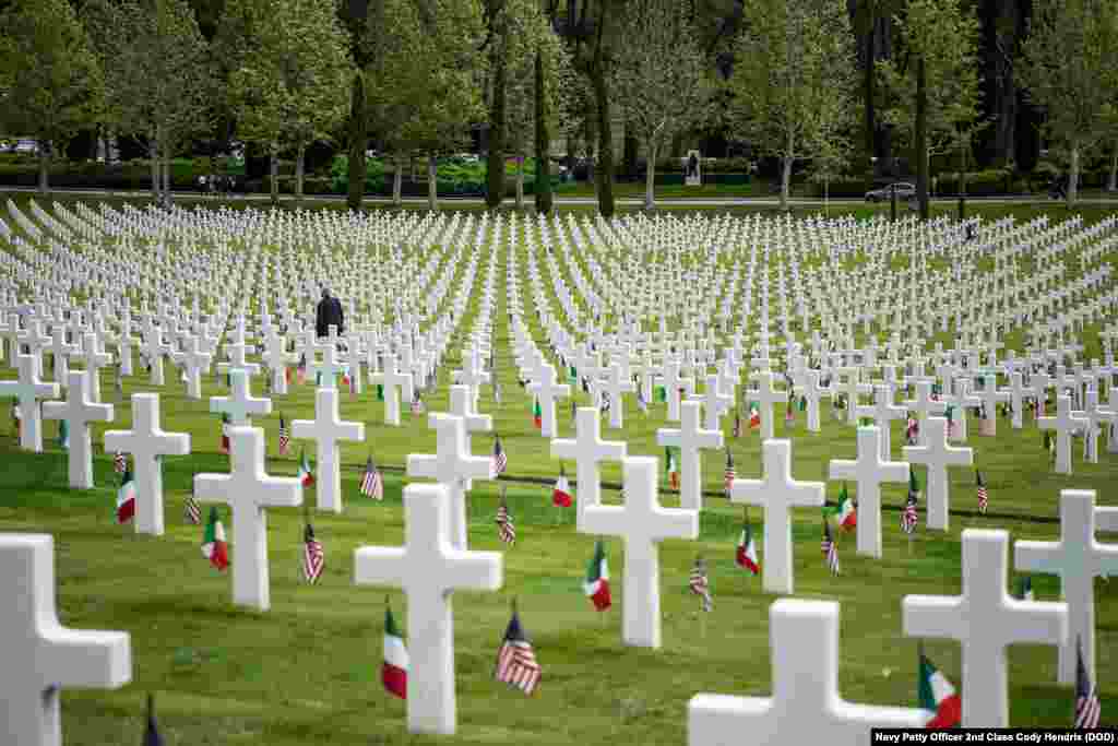 A man walks among the 4,398 tombstones at the Florence American Cemetery during a Memorial Day ceremony in Florence, Italy, May 27, 2019.