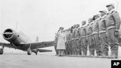 FILE - Major James A. Ellison, left, inspects the cadets at the Basic and Advanced Flying School for Black United States Army Air Corps cadets at the Tuskegee Institute in Tuskegee, Ala., in Jan. 23, 1942.
