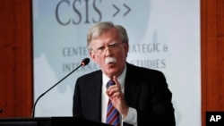FILE - Former National Security Adviser John Bolton gestures while speaking at the Center for Strategic and International Studies in Washington, Sept. 30, 2019.