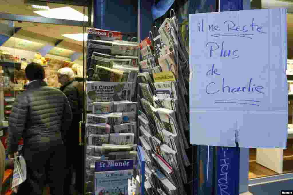 A handwritten sign, which reads "No more Charlie," is displayed after it sold out the limited stock of the satirical newspaper in Paris Jan. 14, 2015.