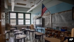 FILE - An empty elementary school classroom is seen on Tuesday, Aug. 17, 2021 in the Bronx borough of New York. (AP Photo/Brittainy Newman, File)