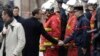 Macron Tours Damaged Arc de Triomphe after Paris Riots
