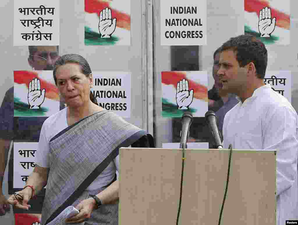 Congress party chief Sonia Gandhi and her son and vice president of Congress, Rahul Gandhi, leave after addressing a news conference. India's Nehru-Gandhi dynasty, the towering force of Indian politics for much of the last century, faces a fight for its survival, in New Delhi, May 16, 2014.