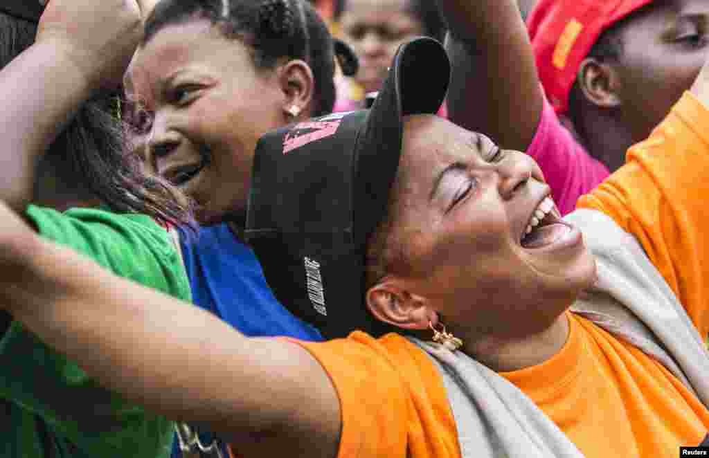 Jane Mukuninwa, 25, dances during a global rally "One Billion Rising", Bukavu, DRC, Feb.14, 2013.