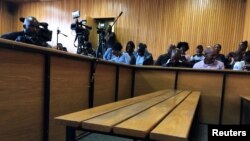 The dock sits empty as people await the arrival of Lesotho's Prime Minister Thomas Thabane in court in Maseru, Lesotho, Feb. 21, 2020. 