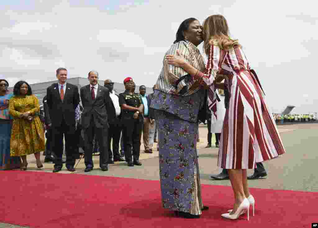 First lady Melania Trump is greeted by Ghana's first lady Rebecca Akufo-Addo as she arrives at Kotoka International Airport in Accra, Ghana, Oct. 2, 2018.
