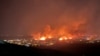 Gedung-gedung terbakar saat kobaran api yang disebabkan oleh angin kencang melalap rumah warga, dan memaksa ribuan warga dievakuasi di Denver, Colorado, pada 30 Desember 2021. (Foto: Gregg Corella/Handout via Reuters) 