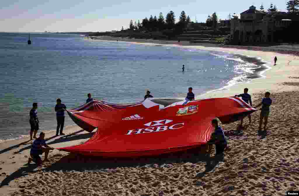 A giant British and Irish Lions team jersey is unveiled on Perth's Cottesloe Beach, Australia.