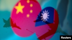Chinese and Taiwanese national flags are displayed alongside military airplanes in this illustration taken April 9, 2021. (REUTERS/Dado Ruvic/Illustration/File)