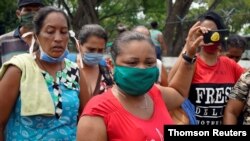 Relatives of inmates protest outside Los Llanos penitentiary in Venezuela on May 2, 2020, after a riot erupted inside the prison, killing dozens.