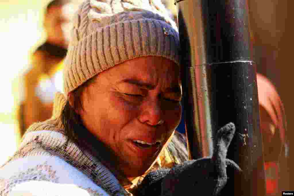 Margelis Tinoco, a migrant from Colombia, reacts after receiving news that her U.S. Customs and Border Protection (CBP) One appointment was cancelled on the inauguration day of Donald Trump's second presidential term, at the Paso del Norte International border bridge in Ciudad Juarez, Mexico, Jan. 20, 2025.