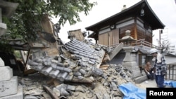 Damaged Myotoku-ji temple caused by an earthquake is seen in Ibaraki, Osaka prefecture, western Japan, in this photo taken by Kyodo June 18, 2018. Kyodo via REUTERS 