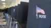 FILE - Voting booths are lined up in Albuquerque, New Mexico, Oct. 26, 2012. 