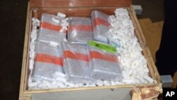 An undated photo provided by the U.S. Customs and Border Protection Federal customs shows cocaine that officials found in Philadelphia, hidden inside bedroom furniture and kitchen cabinets shipped from Puerto Rico.