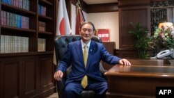 Newly elected leader of Japan's Liberal Democratic Party (LDP) Yoshihide Suga poses for a portrait at his office following a press conference at the party's headquarters in Tokyo on September 14, 2020. 