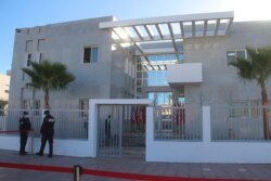 Security personnel stand guard outside the provisional consulate of the U.S. in Dakhla, Morocco-administered Western Sahara, Jan. 10, 2021.