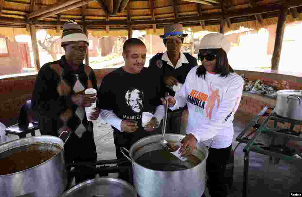 Nelson Mandela's granddaughter Ndileka (R) serves soup as she celebrates Mandela Day with 67 minutes of public service to honour the 67 years Mandela served humanity by first fighting against white-minority rule and then consolidating racial harmony when he was president, at the SOS children's home in Mamelodi township outside Pretoria July 18, 2013.