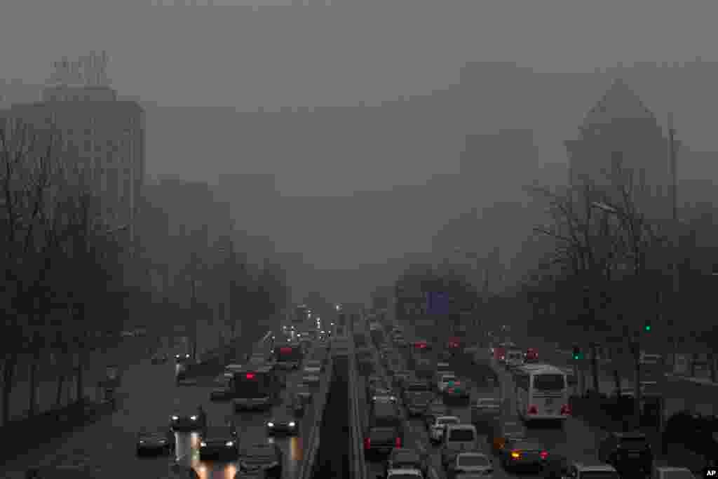 Cars are seen in thick smog in Beijing on Jan. 31, 2013. Air pollution is killing up to 500,000 people a year in China according to the country’s former health minister.