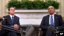 President Barack Obama hosts a bilateral meeting with Mexican President Enrique Peña Nieto, Jan. 6, 2015, in the Oval Office of the White House.