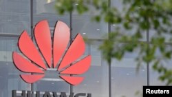 FILE - Signage is seen at Huawei offices in Reading, Britain, May 2, 2019. 